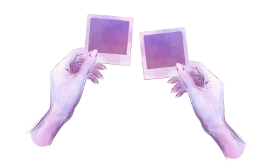 Two hands holding up two photographs side by side.